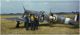 Preparing for battle: As ground crewmen inspect a Supermarine Spitfire fighter plane in a deserted field outside of London in 1941 pilots discuss their strategy for fighting in the air